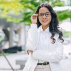 portrait Indian business women standing happy smile. businesswomen arm folded happy in green city portrait Indian business women standing happy smile. businesswomen arm folded happy in green city